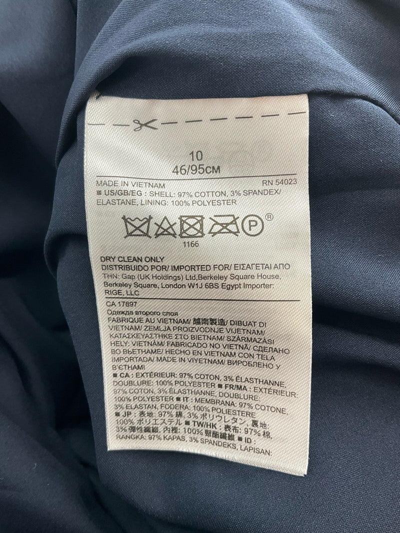 Garment care and fabric content tag for Banana Republic navy strapless dress, size 10, made of cotton blend with spandex and polyester lining.
