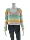 Pink Lily square neck long sleeve rainbow sweater in size small, styled on mannequin with black pants. Available at Margaret’s Fine Consignments.