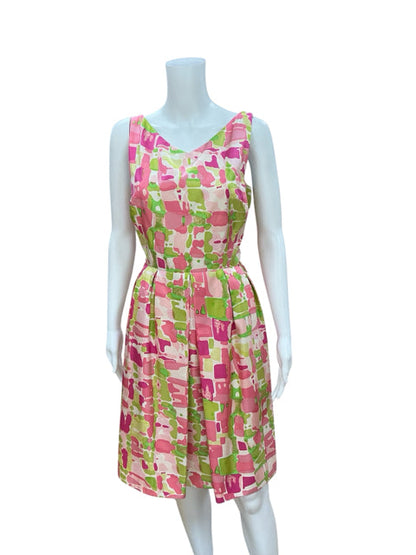 Front view of Kay Unger White/Green/Pink Print Pre-Owned Ladies Dress - Size 10 on mannequin, showcasing vibrant abstract floral pattern and fit &amp; flare cut.