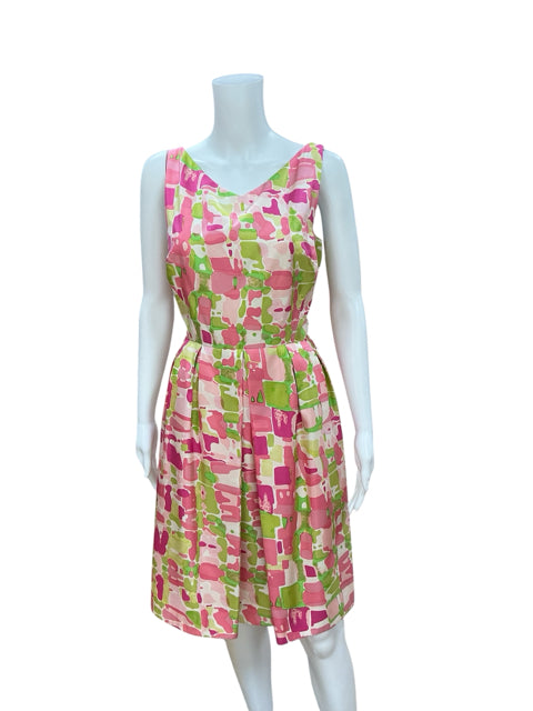 Front view of Kay Unger White/Green/Pink Print Pre-Owned Ladies Dress - Size 10 on mannequin, showcasing vibrant abstract floral pattern and fit & flare cut.