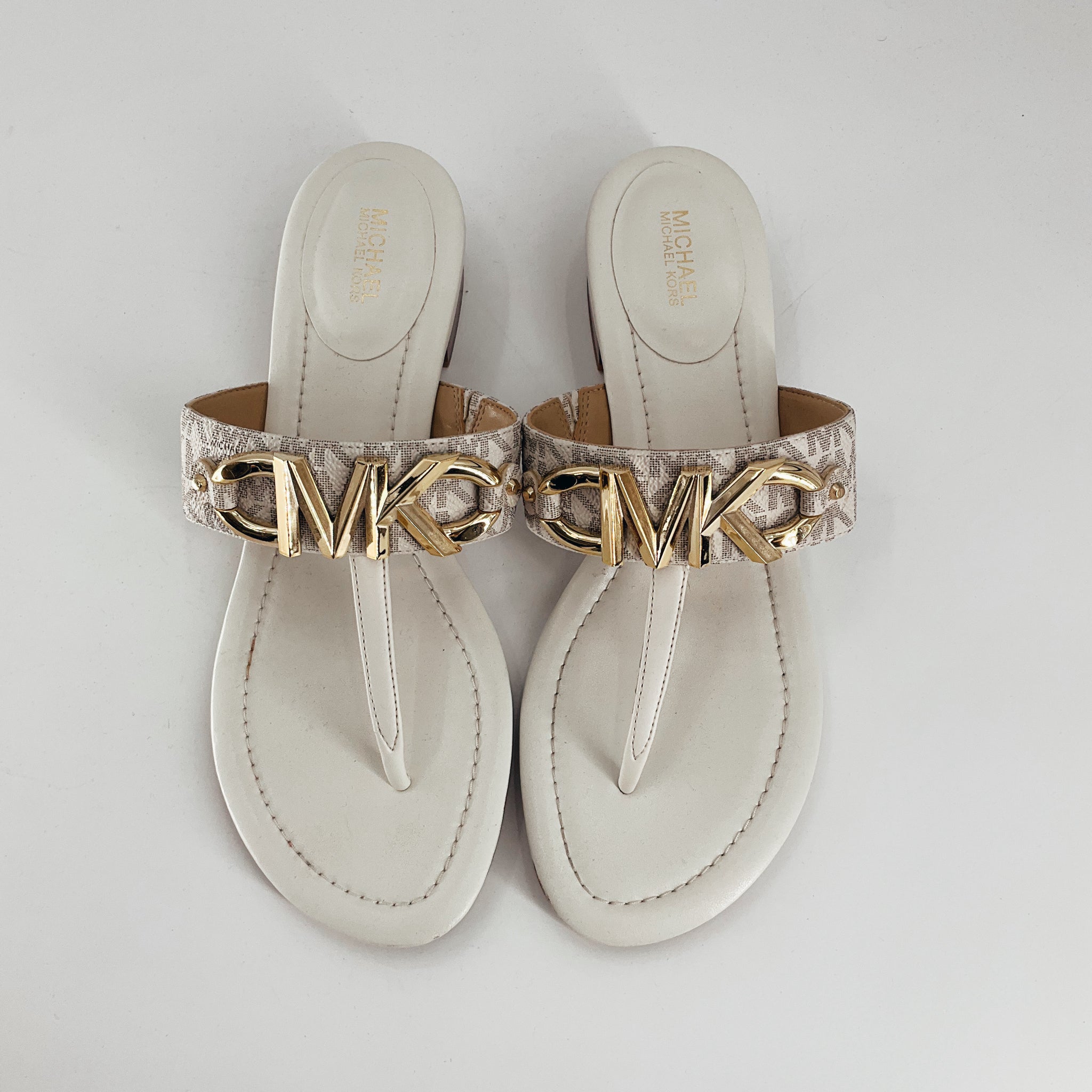 Top view of MK Cream Logo Flip Flop Sandals Size 8.5 featuring gold MK logo on patterned straps, ideal for pre-owned designer fashion lovers.