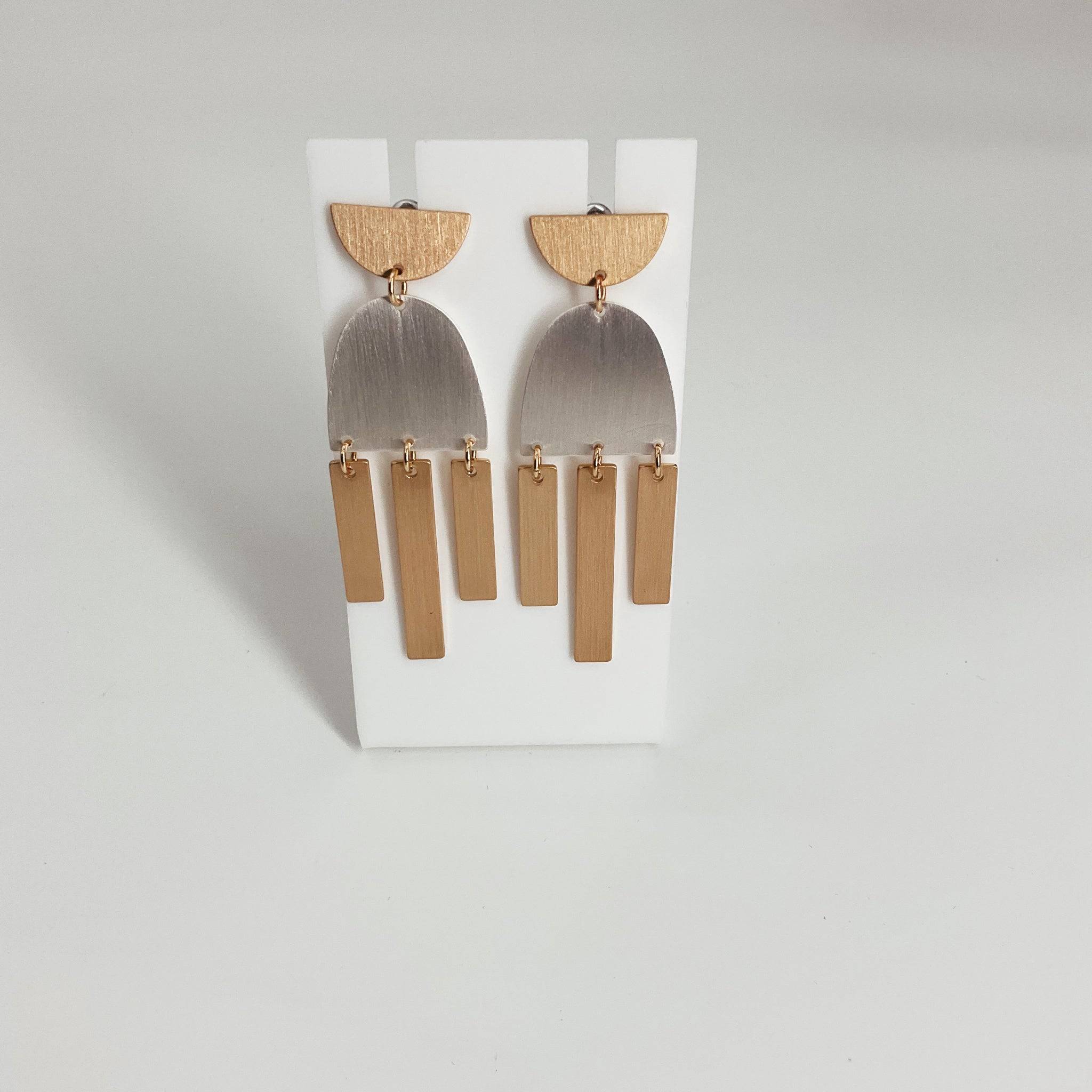 Modern geometric dangle earrings with gold and silver-tone metal, featuring a half-moon top and vertical bar accents. Stylish accessory in Earrings category.