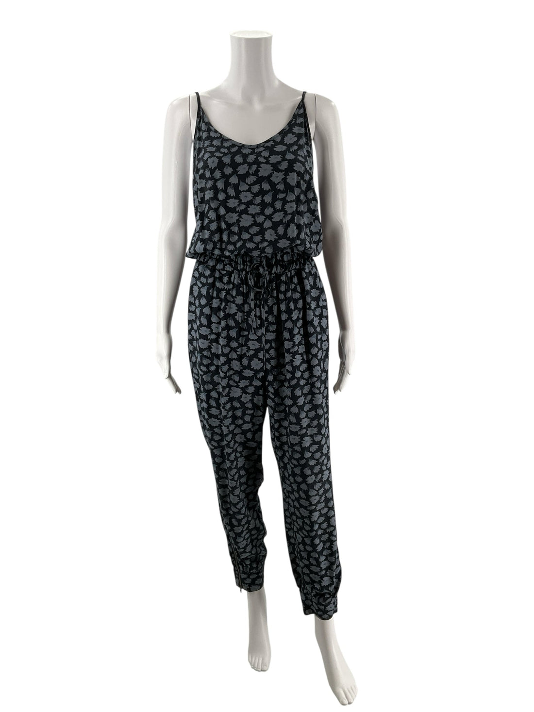Navy floral Banana Republic ladies jumpsuit, size 4, featuring a cami top and tapered leg design.