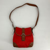Coach Red/Brown Emblem Crossbody purse with signature C pattern, leather trim, and buckle flap, available pre-owned at Margaret’s Fine Consignments.