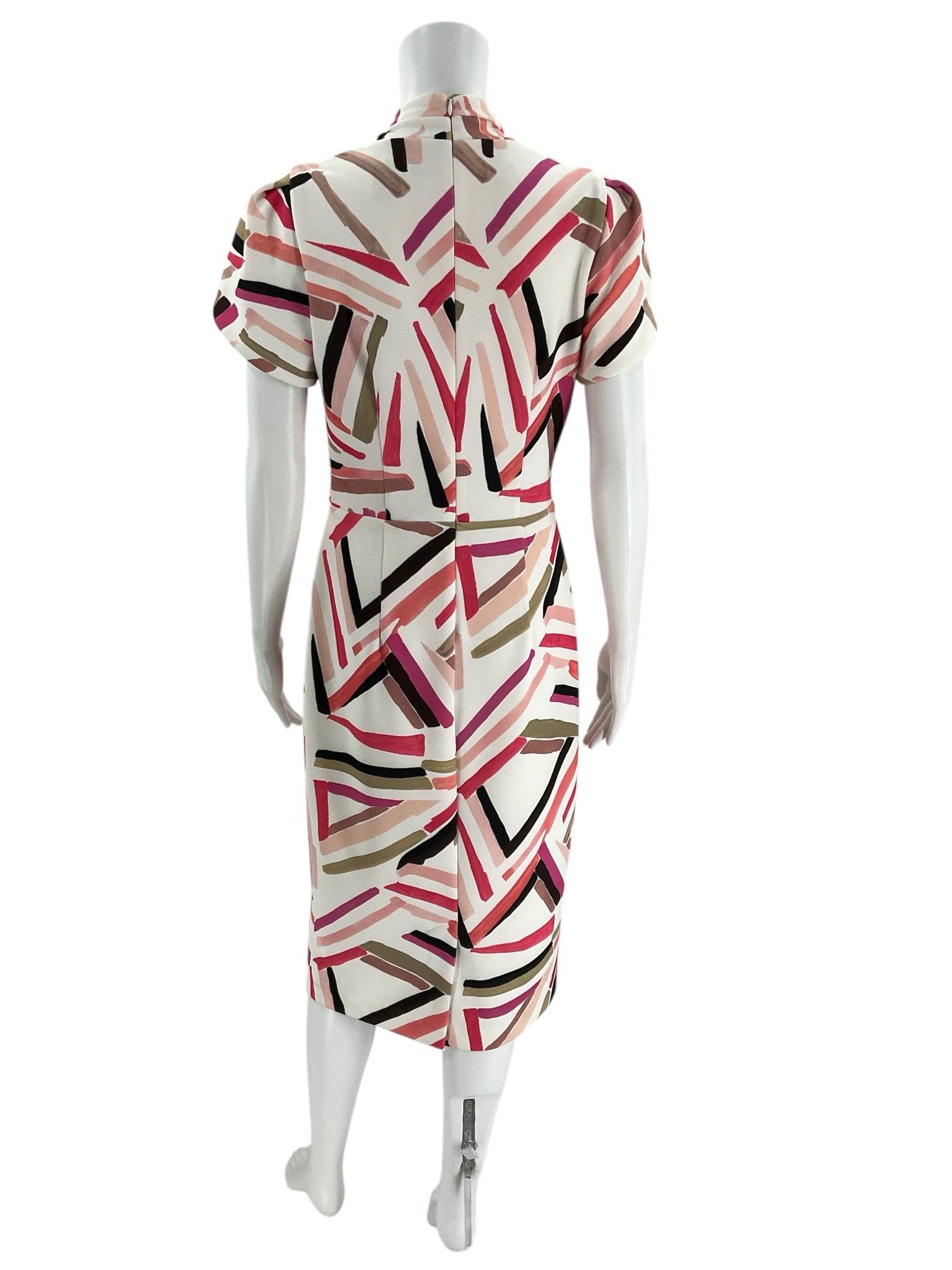Back view of Joseph Ribkoff pink and white geometric print knee-length dress size 6, new with tags at Margaret’s Fine Consignments.
