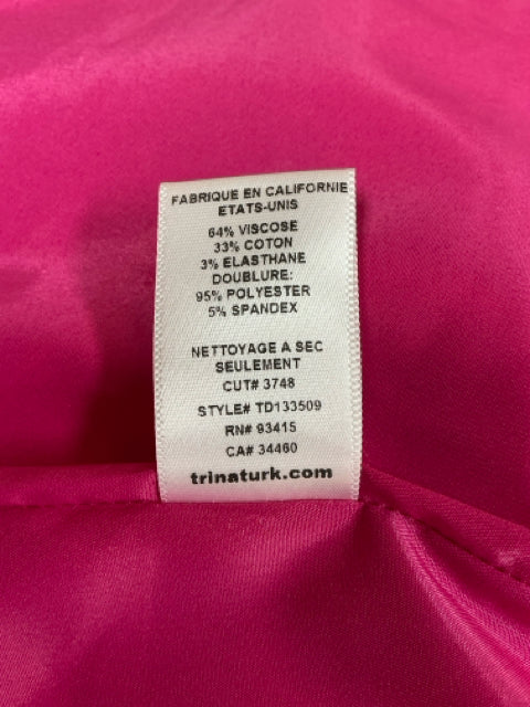 French version of fabric content tag for Trina Turk Pink Textured Pre-Owned Ladies Dress - Size 10, highlighting care instructions and material blend.