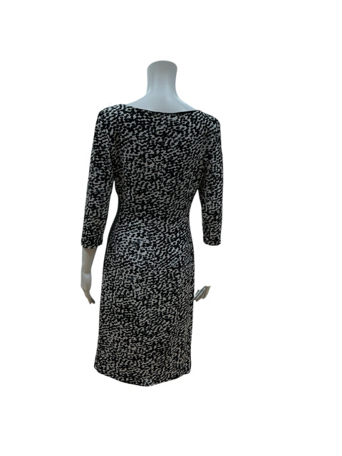 Back view of Ralph Lauren Black/White Animal Print Faux Wrap Dress, size 8, showcasing slimming silhouette and 3/4 sleeves.