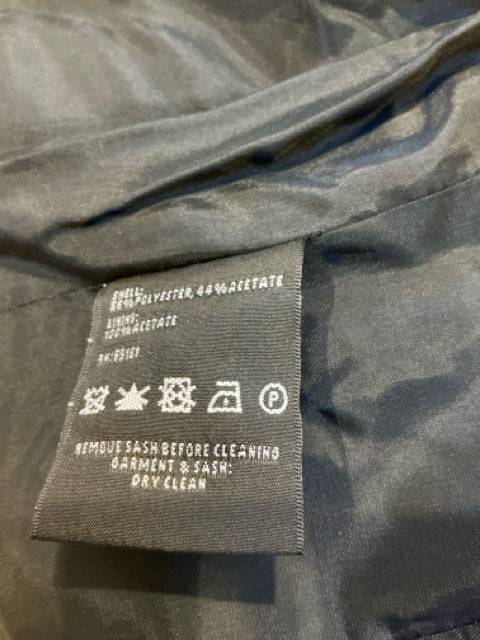Close-up of care label on Carlisle Jacket Size 4, showing fabric composition and dry clean instructions, listed at Margaret’s Fine Consignments.