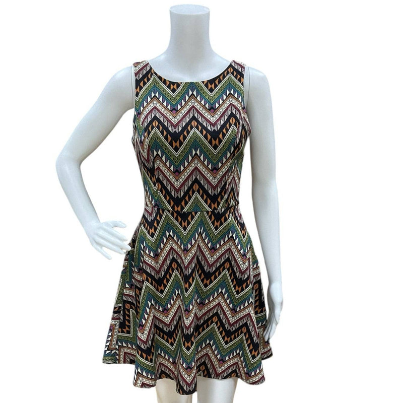 Front view of Lush Navy/Multi Chevron Dress Size Small on mannequin, featuring bold zigzag pattern and fitted waist.