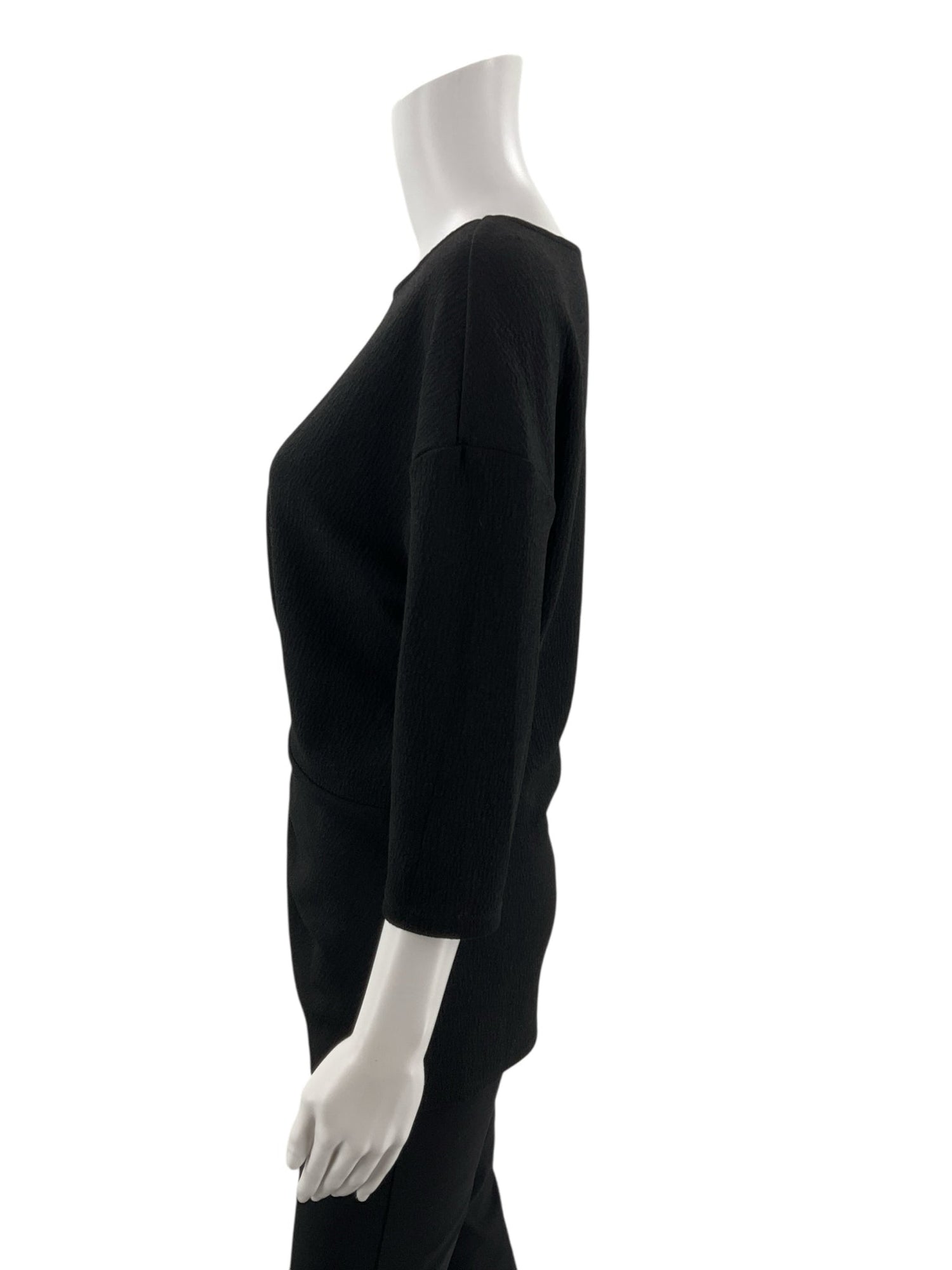 Vince Camuto black pre-owned ladies top, boat neck with twist front and drop shoulder, size small, casual and business casual style.