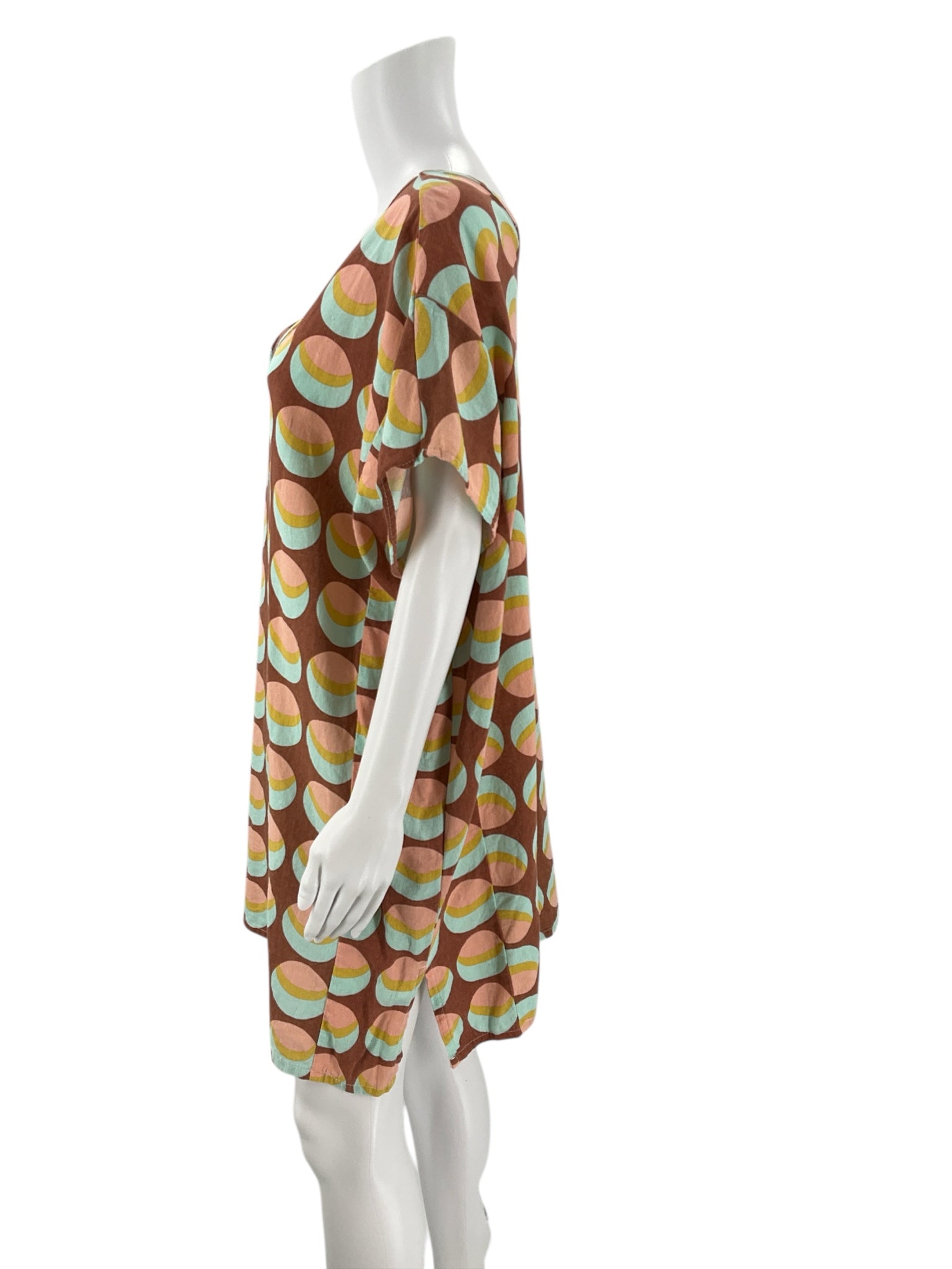 Side profile of Becasa Rust/Multi Circles Print Dress - Size XS showing short sleeves and lightweight linen fabric. Available pre-owned at Margaret’s.