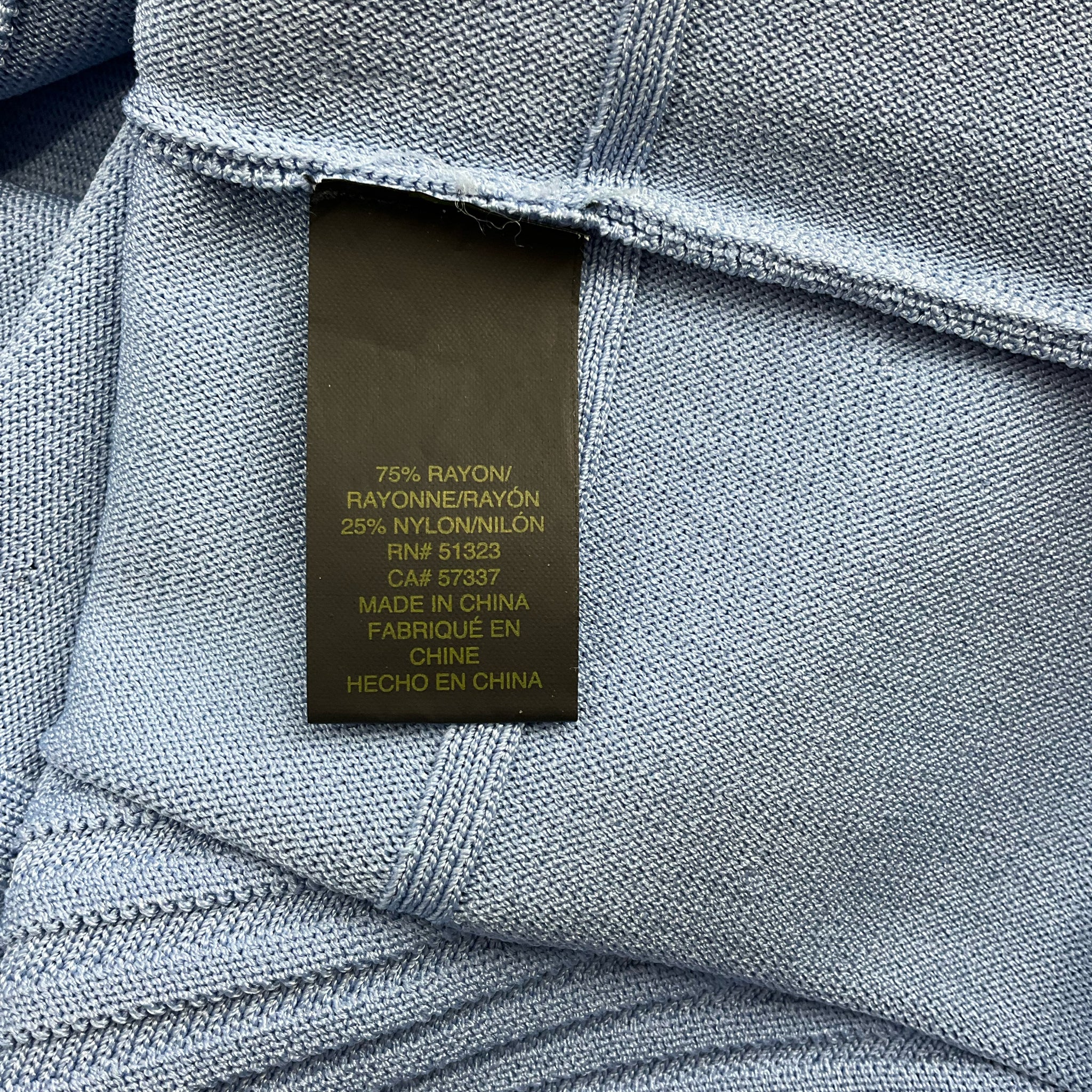 Fabric content tag of Cynthia Steffe Blue Textured Dress - Size Large showing 75% rayon and 25% nylon blend, made in China.