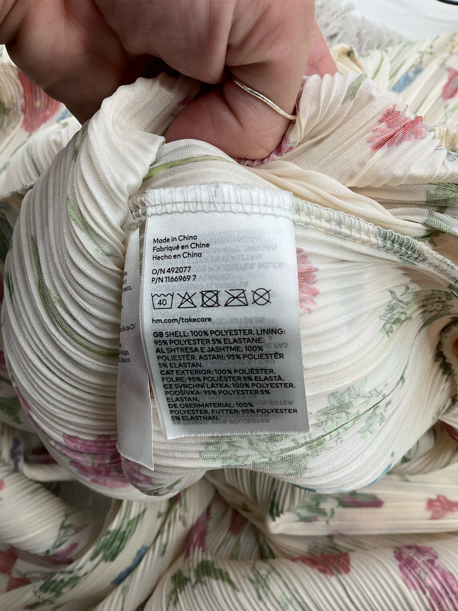 H&amp;M cream and multi floral maxi dress with pleated, halter neck, open back, and tiered skirt in size large.