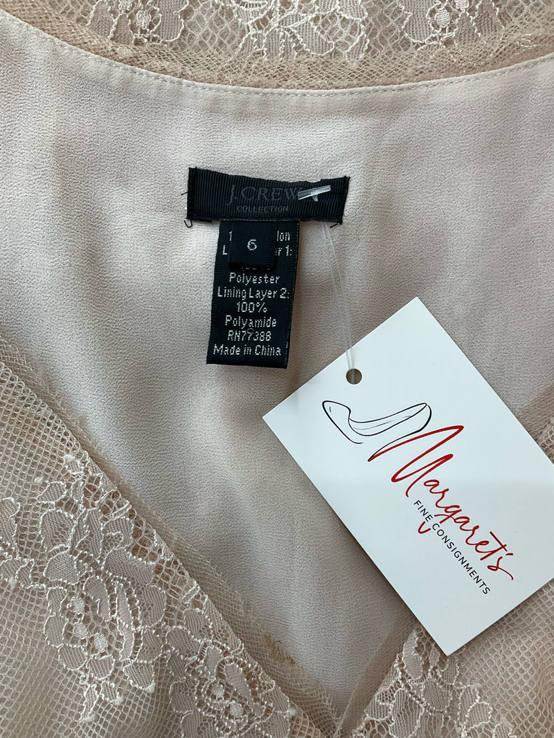 Close-up of J Crew Natural Lace Pre-Owned Ladies Top - Size 6 label showing brand tag, size 6, and fabric composition for secondhand apparel listing.