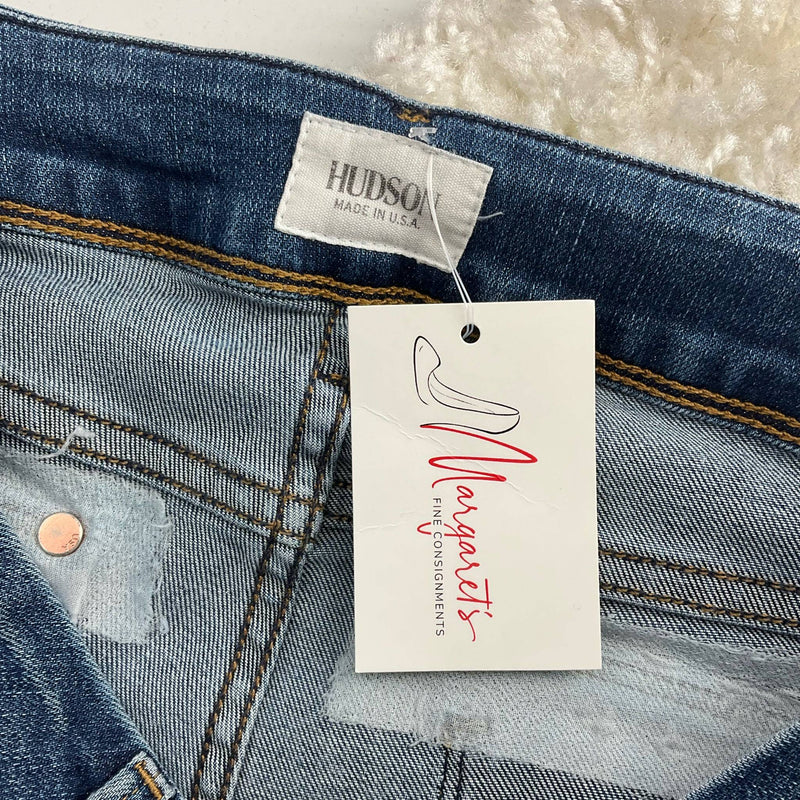 Close-up of Hudson jeans waistband label and Margaret's Fine Consignments tag, confirming authenticity and resale origin.