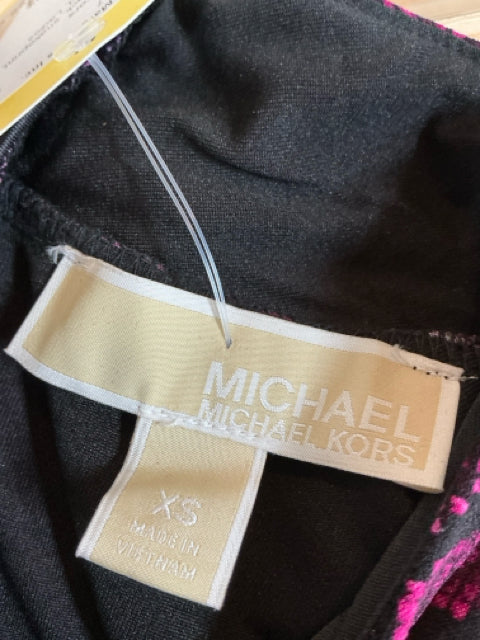 Brand tag of MICHAEL Michael Kors dress in size XS, confirming authenticity and origin as made in Vietnam.