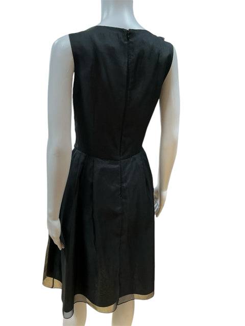 Back view of Lotus Grace Dress Size 10 on mannequin, highlighting the concealed zipper and elegant A-line silhouette in black silk.