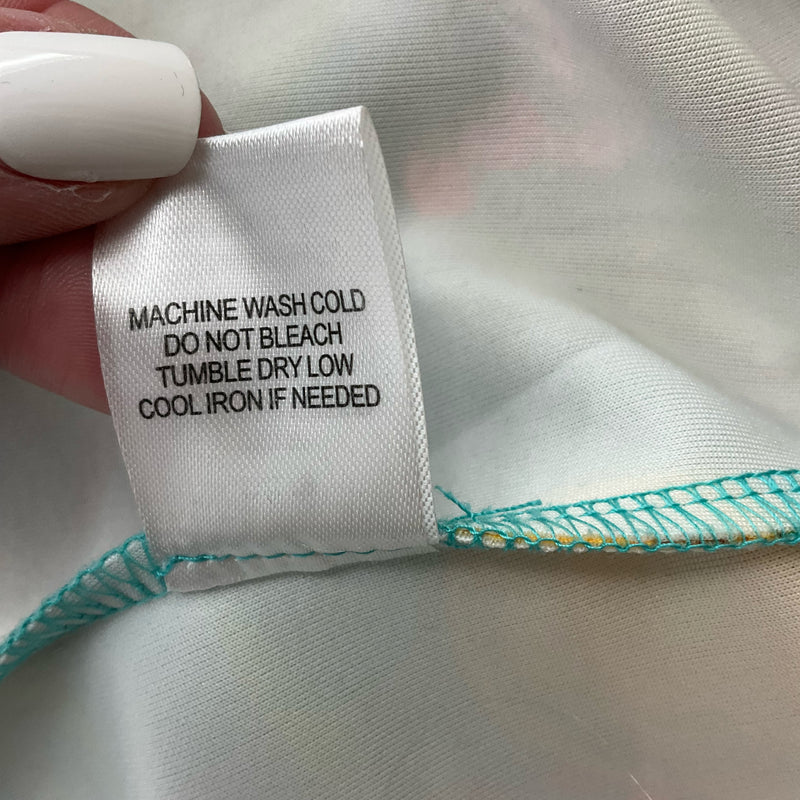 Care label of Alexia Admor tropical fruit sheath dress, instructing machine wash cold, tumble dry low, and cool iron if needed.