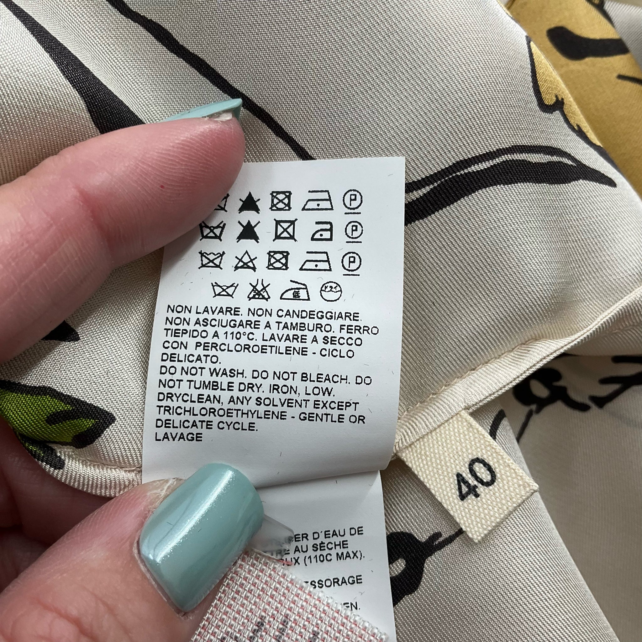 Care label and size tag showing EU 40 for Marni Cream/Multi Floral Dress Size Medium, highlighting fabric care instructions for this pre-owned item.