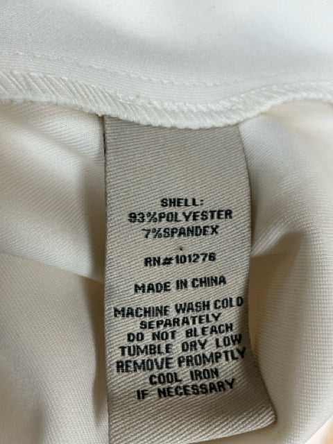 Fabric care label of Eci White Solid Sleeveless Pre-Owned Ladies Dress - Size 10 showing 93% polyester and 7% spandex blend with washing instructions.