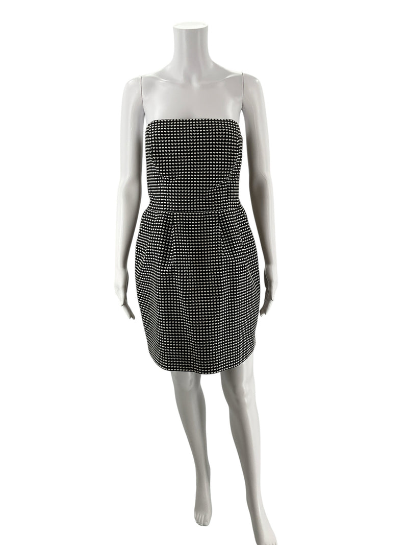 Rachel Roy black and white strapless mini dress on mannequin, featuring heart jacquard pattern and pleated A-line skirt, size 10.