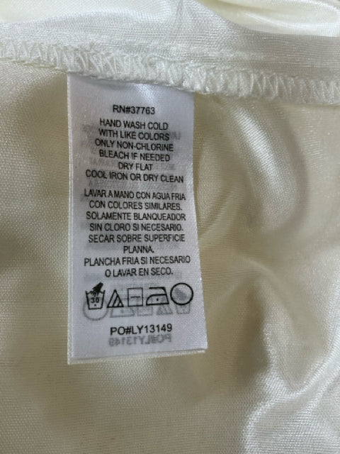 Care label of Laundry Cream Lace Pre-Owned Ladies Dress - Size 4 showing RN#37763 and washing instructions for delicate lace fabric.