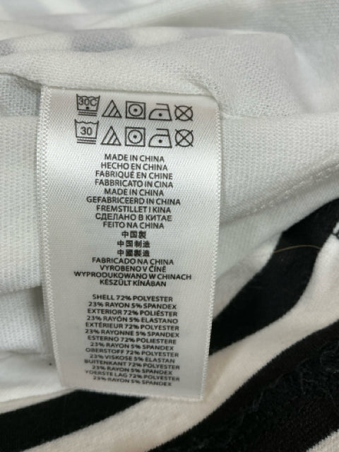 Care label of Michael Kors Black/White Stripe Dress. Indicates polyester-rayon-spandex blend and machine wash instructions.