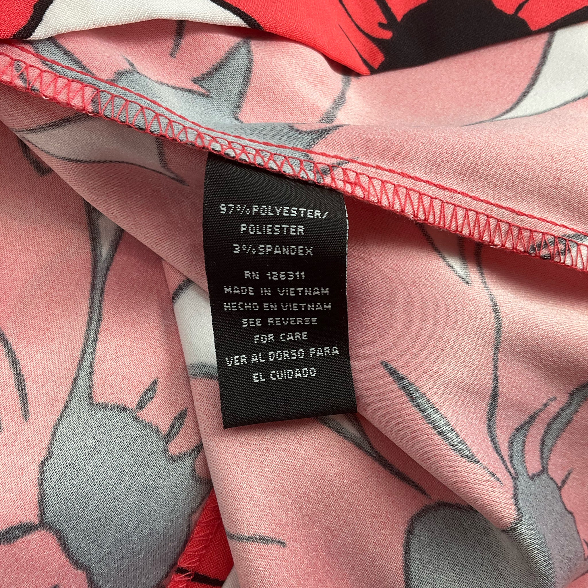 Fabric content tag of Ronni Nicole White/Coral Floral Dress - Size 8 showing 97% polyester and 3% spandex blend for comfort and stretch.