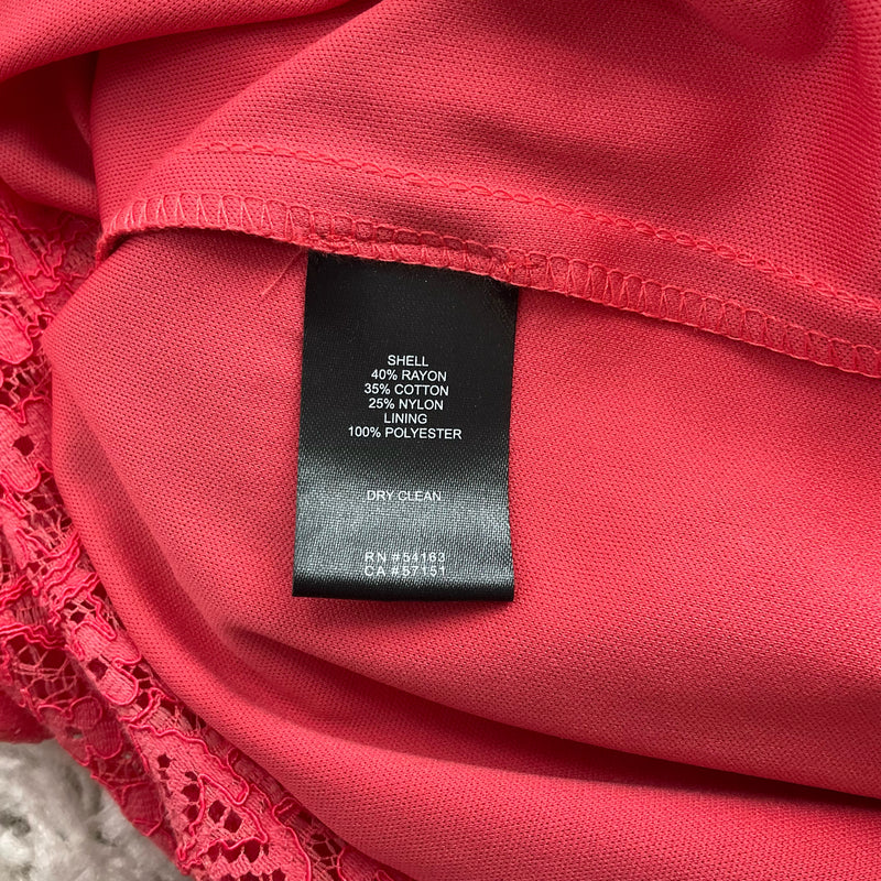 Fabric content label of Jessica Howard Coral Lace Pre-Owned Ladies Dress - Size 16W showing rayon, cotton, nylon, and polyester blend.