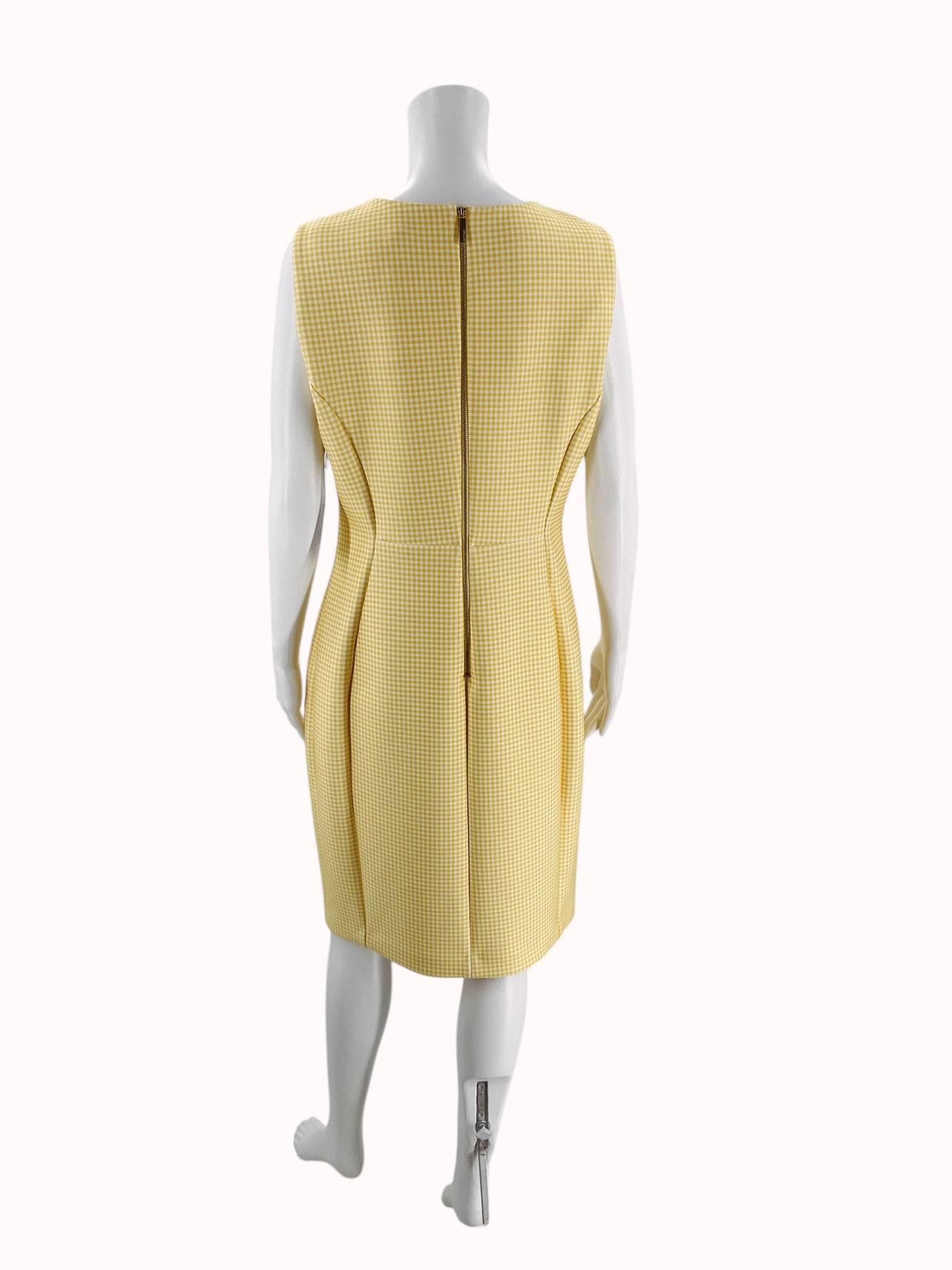 Back view of Calvin Klein yellow and white checkered mini dress, size 12, featuring zipper closure, available at Margaret’s Fine Consignments.