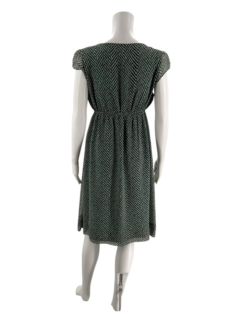 Back view of New York & Co teal and cream empire waist dress, showing herringbone pattern and gathered waist detail on mannequin.