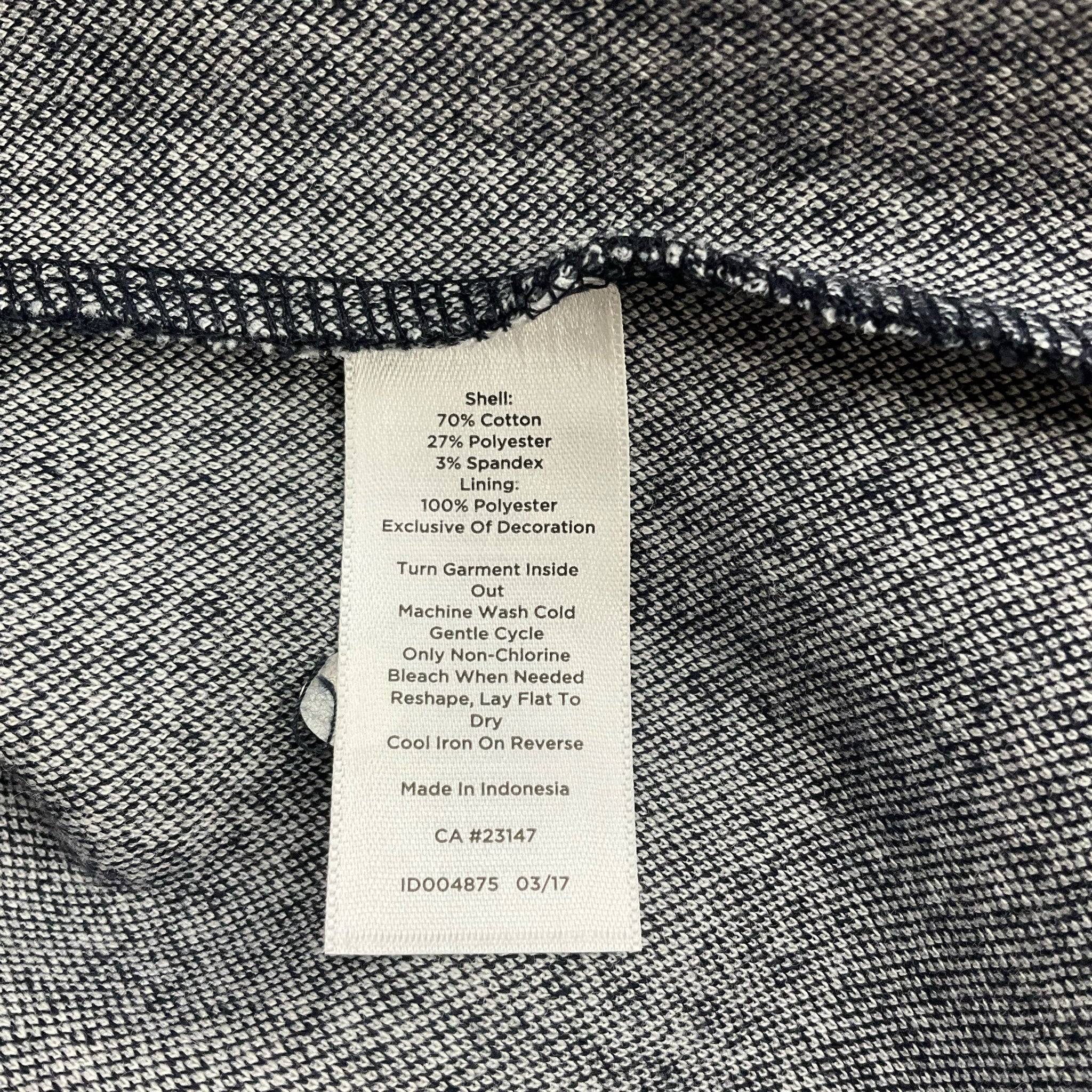 Fabric care label of Talbots Dress Size 14 from Margaret’s Fine Consignments, detailing cotton blend material and washing instructions.