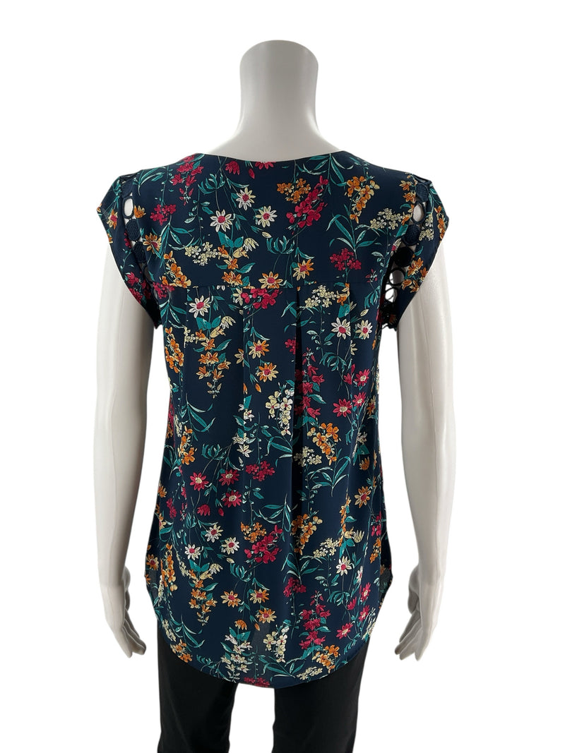 Back view of Daniel Rainn Floral Crochet Trim Sleeveless Blouse Top Size Small showing high-low hem and pleated back detail in vibrant floral print.