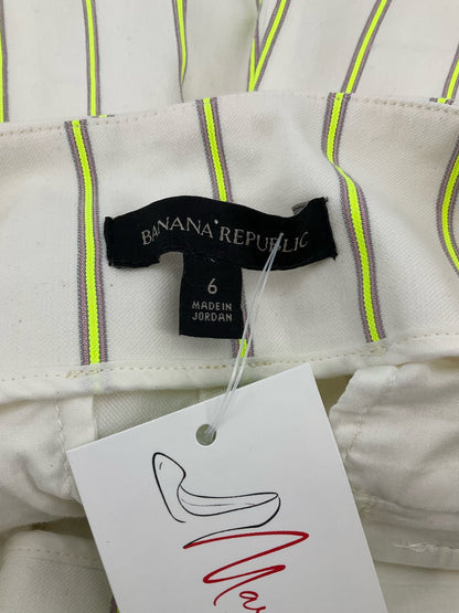 Off white and yellow striped high-rise chino shorts by Banana Republic, size 6, showcasing a classic fit for summer casual wear.