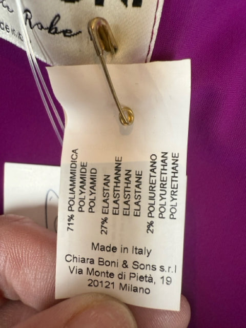 Close-up of Chiara Boni dress fabric tag showing material composition and Made in Italy origin, confirming designer quality.