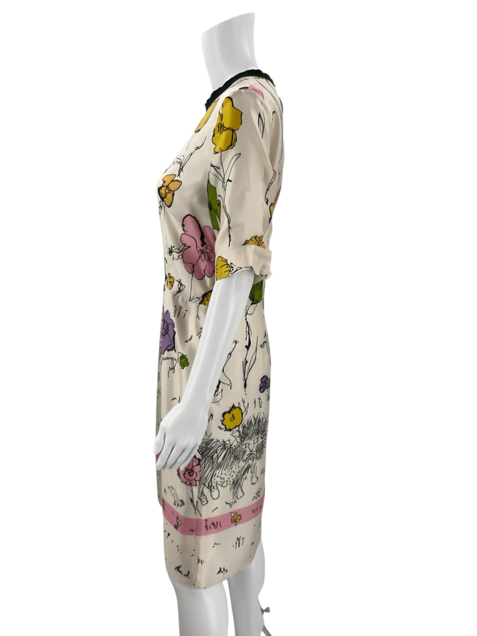 Side profile of Marni Cream/Multi Floral Dress Size Medium featuring mid-length sleeves and artistic floral design, gently used designer dress.