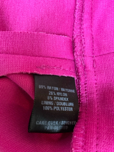 Close-up of fabric content tag on Chequer Pink/Black Pre-Owned Ladies Dress - Size 10, showing rayon, nylon, and spandex blend.