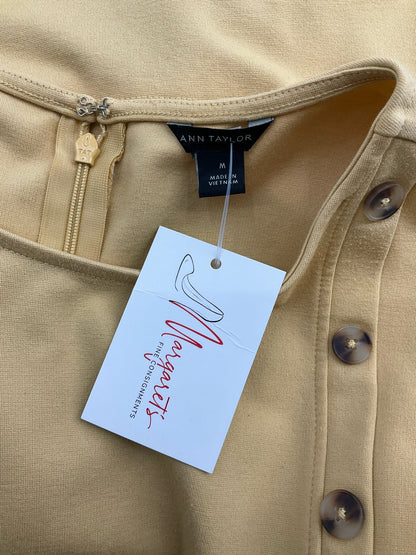Ann Taylor mustard peplum blouse with buttons, sleeveless, size medium, perfect for career attire.