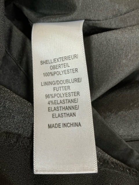 Fabric content tag of Adrianna Papell Black/Pink Floral Dress indicating 100% polyester shell and polyester-elastane lining.
