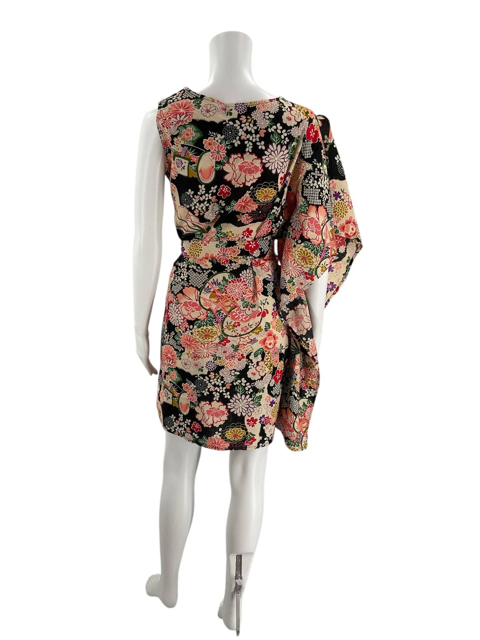 Back view of 100% Pirata 1 Sleeved Mini Dress Size S/M featuring vibrant multi-color floral design, sold by Margaret’s Fine Consignments.