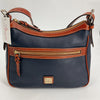Dooney & Bourke Navy/Brown Pebble Purse with gold-tone zipper and tag, new with tags, available at Margaret’s Fine Consignments.