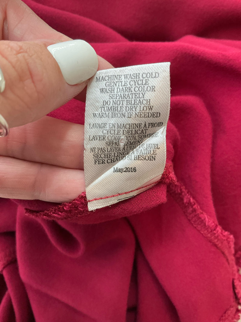 Care label of Altar'd State burgundy dress showing machine wash instructions and manufacturing date of May 2016.