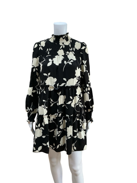 Anna Kaci black and cream floral print long sleeve dress, size small, featuring a smocked high neckline and tiered skirt, new with tags.