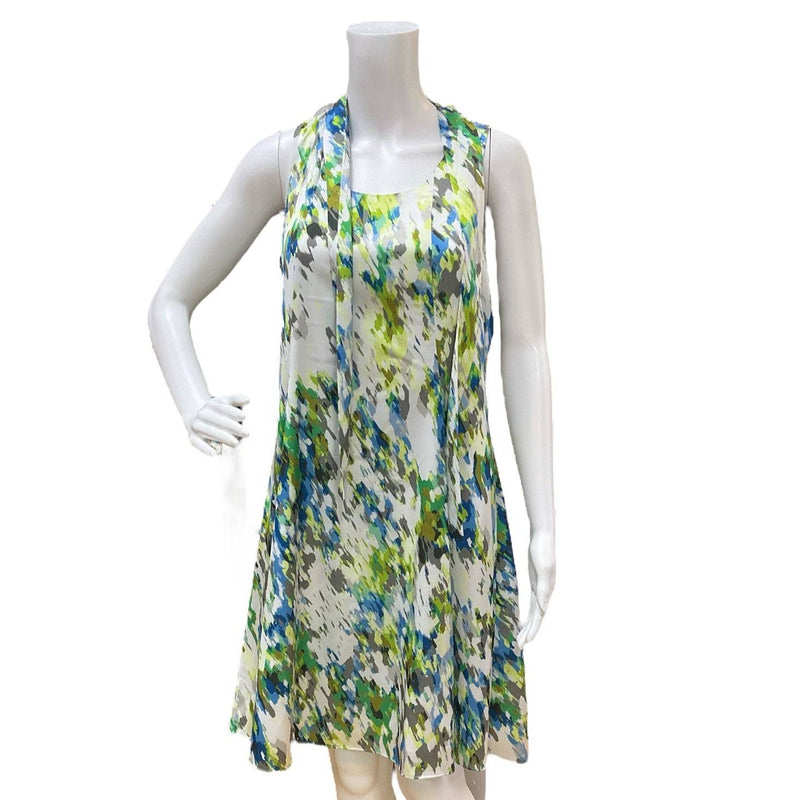 Cenia White/Blue/Green Print Dress – Size 6 displayed on a mannequin, sleeveless with vibrant abstract print, ideal for warm-weather wear.