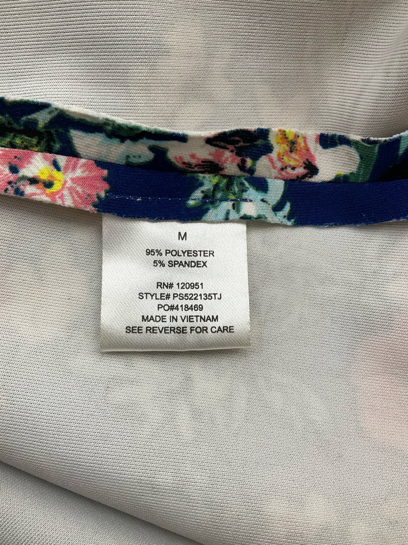 Fabric content label of Pink Rose floral dress, indicating 95% polyester and 5% spandex, size M, style PS522135TJ.