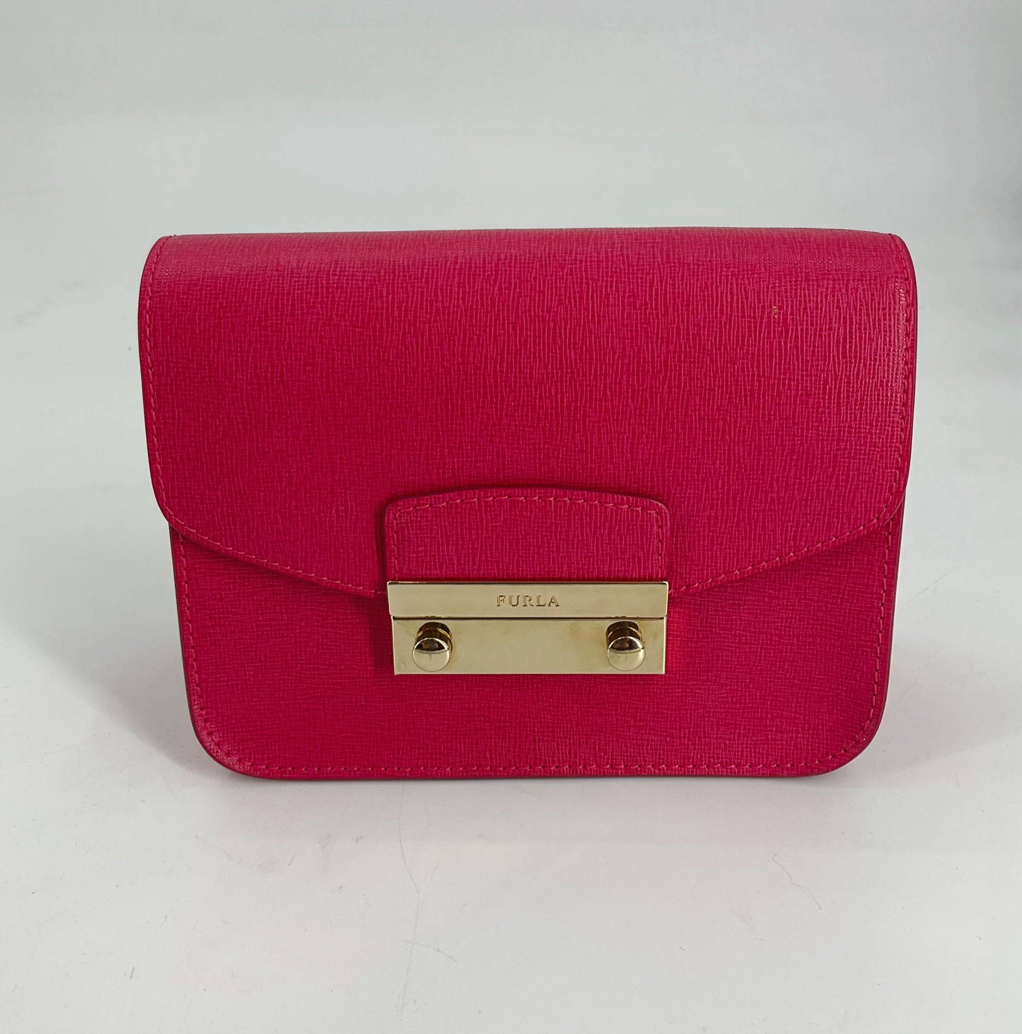 Furla Pink Solid Pre-Owned Clutch with gold-tone clasp, featured at Margaret's Fine Consignments. Elegant textured leather design for stylish occasions.
