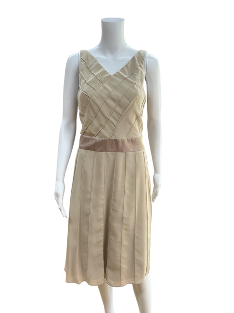 Front view of Rabbit Rabbit Rabbit Beige Pre-Owned Dress, size 6, featuring A-line silhouette, sleeveless cut, and champagne satin waist detail.