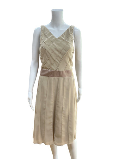 Front view of Rabbit Rabbit Rabbit Beige Pre-Owned Dress, size 6, featuring A-line silhouette, sleeveless cut, and champagne satin waist detail.