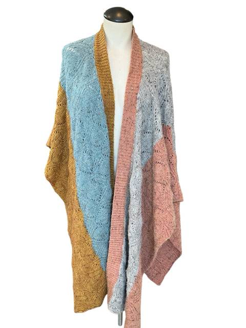 Front view of Sundance Shrug Size XS/S on mannequin, featuring soft knit in blue, mustard, pink, and grey blocks. Sustainable style from Margaret’s Fine Consignments.