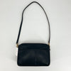 Coach Black Solid Purse with shoulder strap, gently used and pre-owned, available at Margaret’s Fine Consignments. Sleek leather design for everyday luxury.